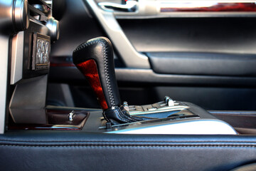 Automatic transmission shift knob.  Direct-shift gearbox. Car gear stick on parking mode. Closeup a...