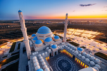 Astana Grand white mosque evening at sunset, Nur Sultan in capital of Kazakhstan Asia, Aerial view.