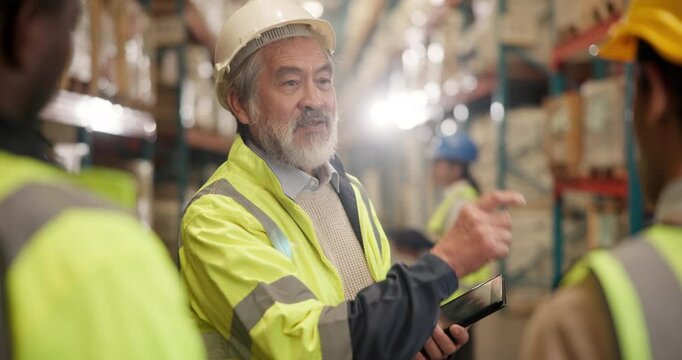 Warehouse, man and tablet with talking in team for production, logistics and shipping company. Mature male person, supervisor and tech in distribution, job in factory for supply chain or industry