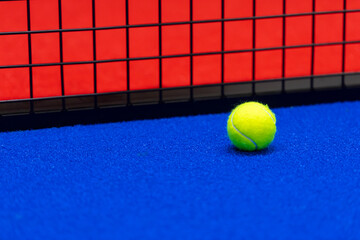 Paddle tennis and tennis ball on blue court. Horizontal sport poster, greeting cards, headers,...