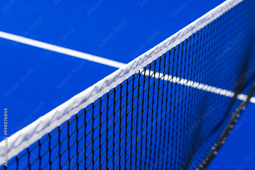 Canvas Prints Paddle tennis and tennis net on blue court. Tennis competion concept. Horizontal sport poster, greeting cards, headers, website