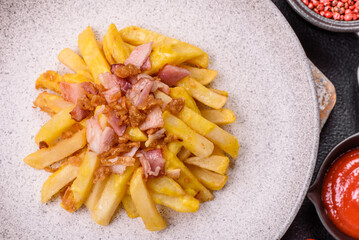 Crispy French fries with pieces of bacon, salt and spices