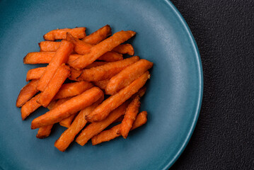 Delicious crispy sweet potato fries with salt, spices and herbs