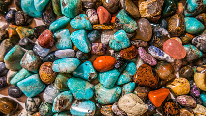 Many colorful polished stones and gems. Perfect for background or wallpaper