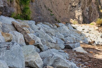 rocks next to cliffs in Robin Hood’s Bay - North Yorkshire - Great Britain