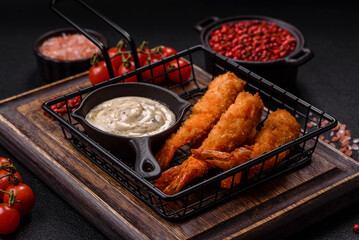 Hot crispy shrimp breaded with salt and spices with white sauce