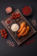 Hot crispy shrimp breaded with salt and spices with white sauce