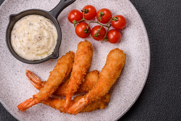 Hot crispy shrimp breaded with salt and spices with white sauce