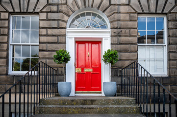 A house with Georgian door at Stockbridge suburb in Edinburgh, UK.