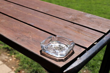 Ashtray for cigarettes and ash when smoking.