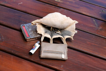 Ashtray for cigarettes and ash when smoking.