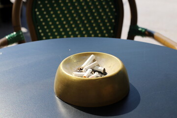 Ashtray for cigarettes and ash when smoking.