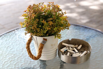 Ashtray for cigarettes and ash when smoking.