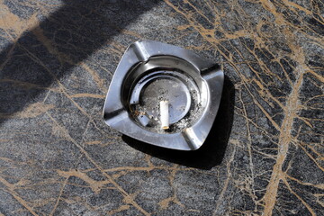 Ashtray for cigarettes and ash when smoking.