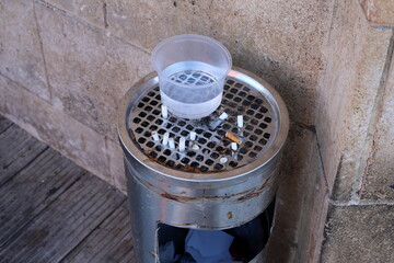 Ashtray for cigarettes and ash when smoking.