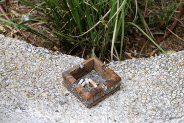 Ashtray for cigarettes and ash when smoking.
