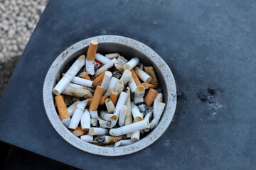Ashtray for cigarettes and ash when smoking.