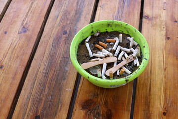 Ashtray for cigarettes and ash when smoking.