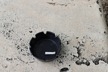 Ashtray for cigarettes and ash when smoking.