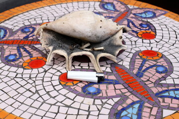 Ashtray for cigarettes and ash when smoking.