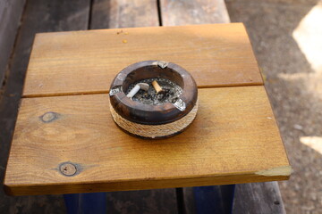 Ashtray for cigarettes and ash when smoking.