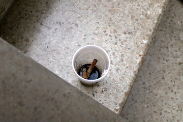 Ashtray for cigarettes and ash when smoking.