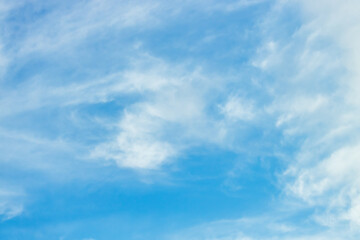 A beautiful sky tinted by the sun leaving vibrant shades of gold, pink, blue and multicolored. Clouds in the twilight evening and morning sky. Cloudy sky background in the evening, and during the day.