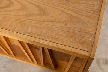 Unique wooden end table nightstand cabinets. Closeup design photograph.