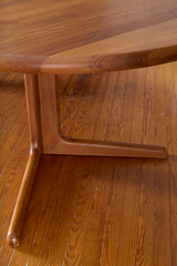 Dining table with extension leaves. Vintage solid teak furniture. Interior product photograph jpg.