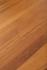 Solid teak wood grain pattern. Close-up detail photograph.