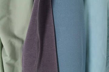 Bolts of soft pastel cloth.