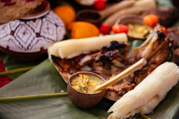 Chicken juane wrapped in bijao leaves. Food, fruits and drinks of the Peruvian jungle, in all its...