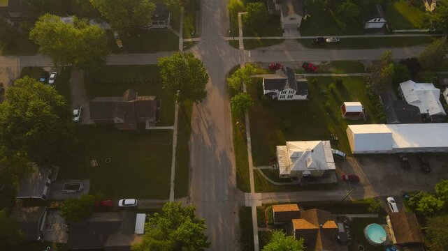 Aerial view of residential street in a quiet suburban neighborhood in Carleton, Michigan, America