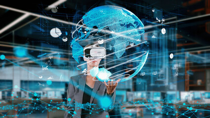 Businesswoman taking up circle finance data dynamic world monitor by VR future global market interface digital infographic network technology virtual hologram animation at modern office. Contraption.