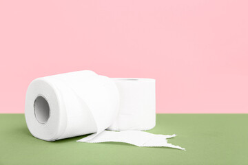Rolls of toilet paper on colorful background