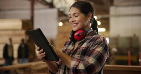 Carpenter, woman and woodwork in workshop with tablet for digital checklist, timber inventory count or online order. Carpentry, worker and happy planning in factory for ecommerce or quality assurance