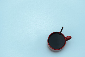 cup of coffee at winter time, cozy atmosphere on the snow