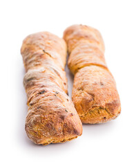 Crusty rustic baguette isolated on white table.