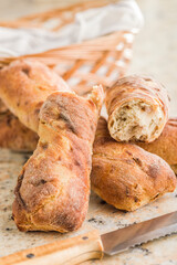 Crusty rustic baguette on kitchen table.