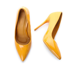 Stylish yellow high heels on white background