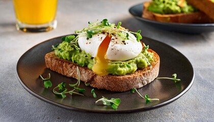 Hearty Avocado Toast Topped with Poached Egg and Microgreens