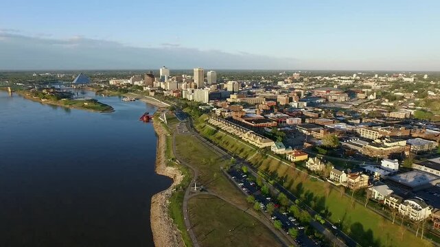 Memphis Cityscape in Tennessee. Architecture and Skyline. Mississippi River and Hernando de Soto Bridge. Trafic in Background. Drone