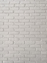 Detailed view of a white brick wall, showcasing its textured surface and uniform pattern. Simplicity and elegance of minimalistic interior design. Background with copy space and empty place for text