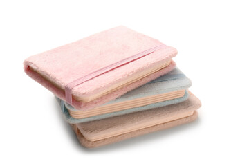 Different fluffy notebooks on white background
