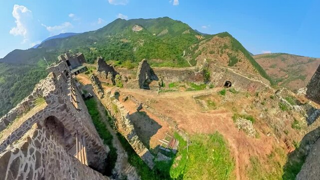 Drone view of Maglic fortress of 13th-century, dominating the Ibar in Serbia, offering a panoramic vista of a Great Morava Valley. A national Monument of Culture of Exceptional Importance in Serbia.