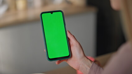 Girl fingers scrolling mockup mobile phone at home closeup. Unrecognizable woman