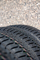 Sharp tread of new winter tires ready for the seasonal change. New tires are important for increasing road safety