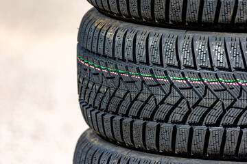 Sharp tread of new winter tires ready for the seasonal change. New tires are important for...