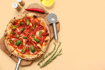 Composition with tasty pizza and cutter on beige background