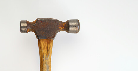 Rusty, vintage hammer with wooden handle on white background, rustic tool concept